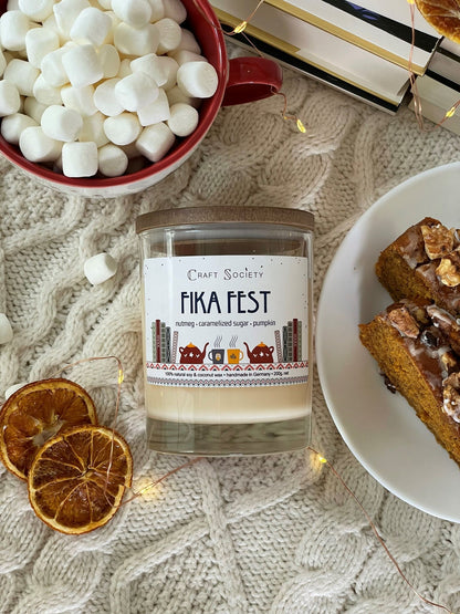 The Fika Fest scented candle with cotton wick from above on a festive background
