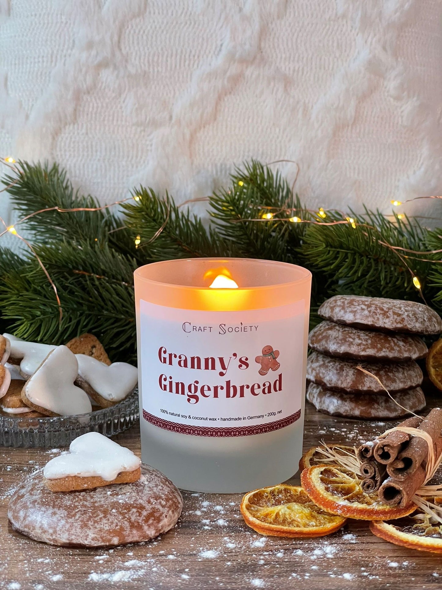 A burning deluxe scented candle made from vegetable wax on a decorated background