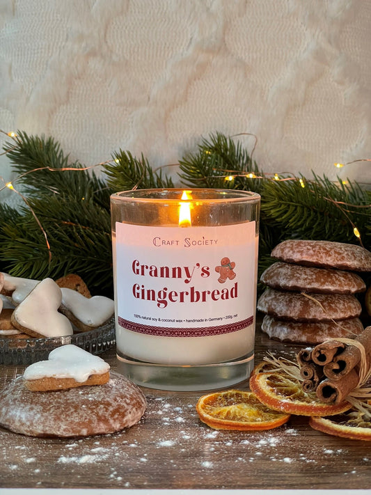 A burning scented candle made from vegetable wax on a decorated background