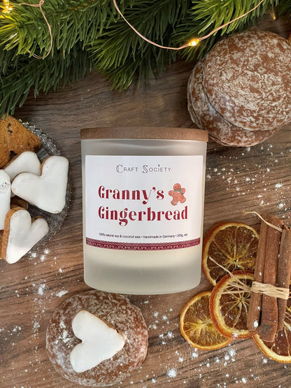 A new deluxe scented candle on a decorated background from above