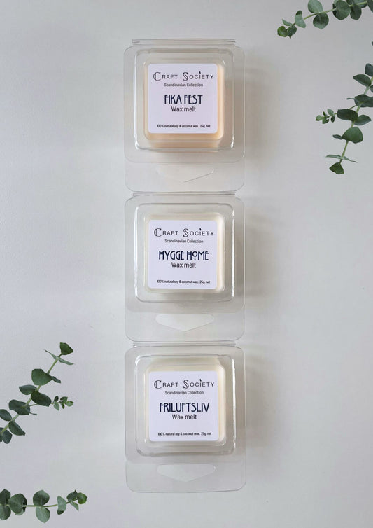 A set of wax melts with scents highlighting 3 candles from the Scandinavian collection