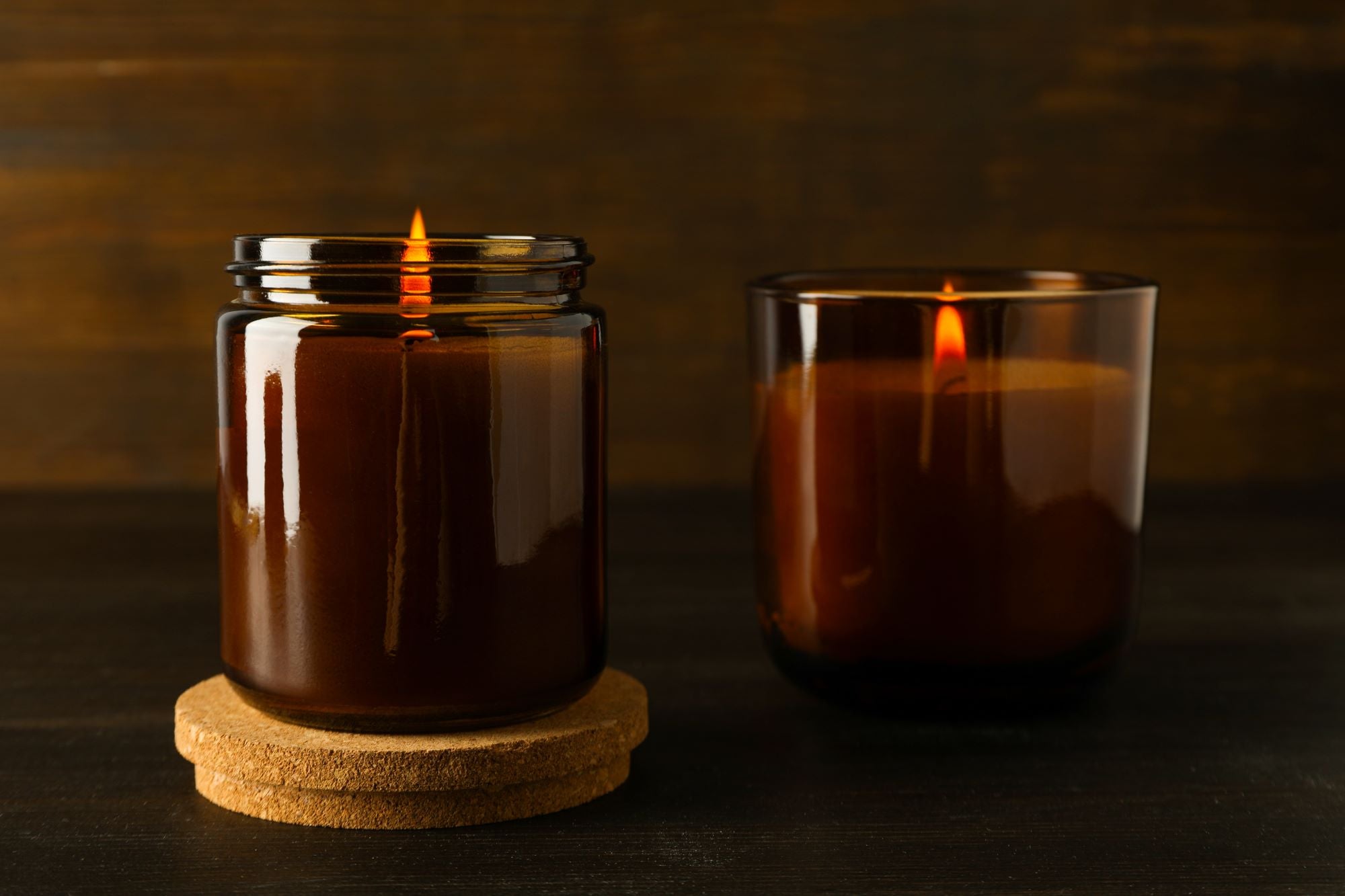 Two scented candles in amber jars